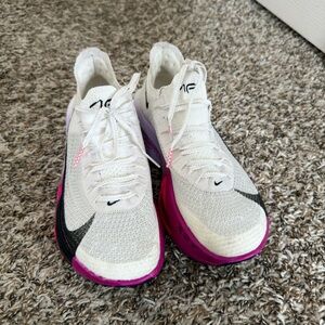 Nike Women's White Flyknit Running Shoes with Black Swoosh and Pink Midsole